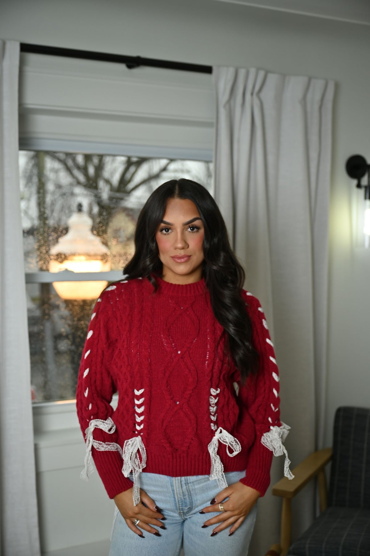 Knit women's sweater with bow detail and cozy pullover design