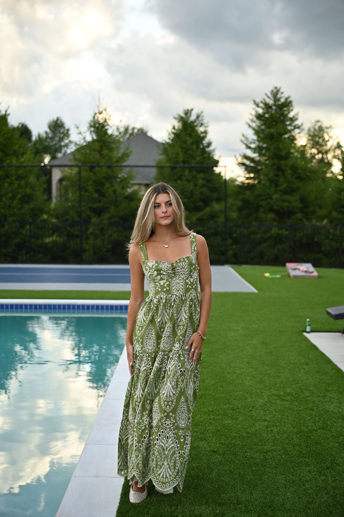 Olive green embroidered dress with paisley-inspired hollow lace detail